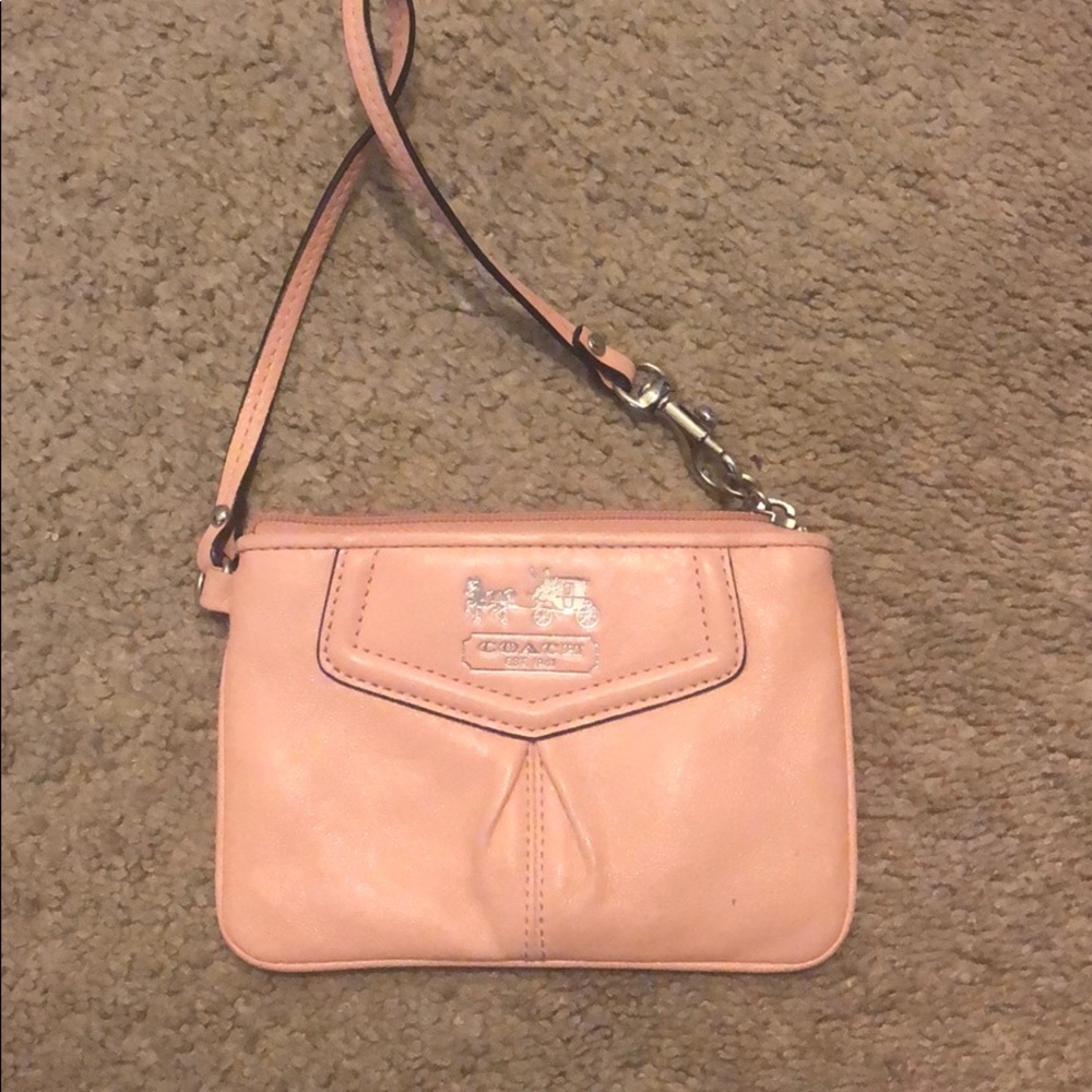 Pink coach clutch